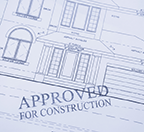 Approved for construction stamped over blueprint image