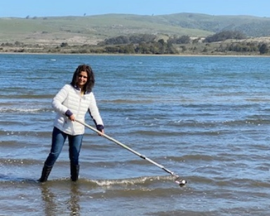 Arti Kundu of Marin County Environmental Health wades into Tomales Bay to monitor water quality. 