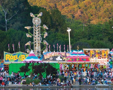 Looking at the 2014 Fair themed the "Happiest Fair on Earth" from across the lagoon