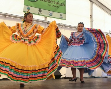 Two female dancers in traditional Mexican dresses perform at the Marin County Fair.