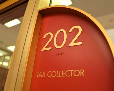 Sign saying Tax Collector, Suite 202