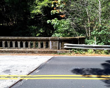 Photo of an old guardrail attached to an old bridge on Sir Francis Drake Boulevard in West Marin.