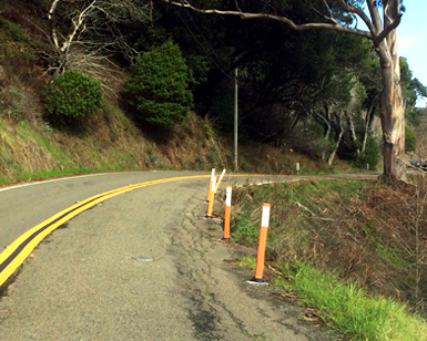Roadside erosion is shown on a section of Muir Woods Road.