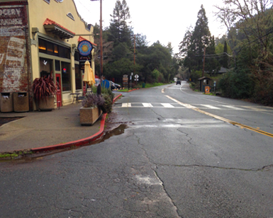 A view of the deteriorated pavement on Sir Francis Drake Bouelvard in front of Lagunitas Groceries & Deli.