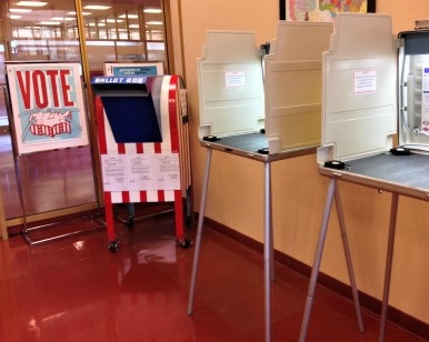 A view of two voting booths and a ballot drop-off box inside the Elections Department at the Marin County Civic Center.
