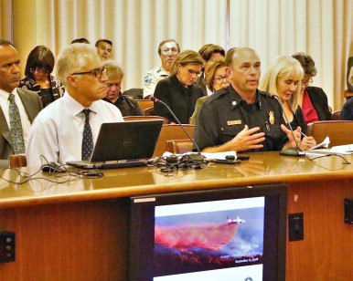 Chris Reilly (left), Emergency Services Manager for the Sheriff's Office, and Jason Weber (right), Marin County Fire Chief, speak at the Board of Supervisors meeting.