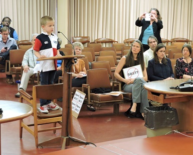 Rhett Krawitt, 7, stands on a chair as he speaks to the Marin County Board of Supervisors in favor of Senate Bill 277.