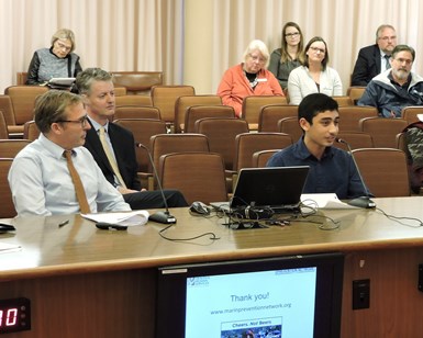 Joshua Rowe (right) of San Domenico School, a member of the Marin Prevention Network, speaks about the social host accountability ordinance at a Board of Supervisors meeting in December 2016 while Public Health Officer Dr. Matt Willis (left) looks on.