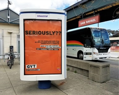 An advertising poster for STD Awareness Week is shown at the downtown San Rafael bus depot.