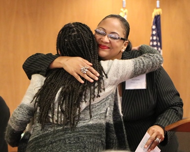 Marin County Human Rights Commissioner Gina Fromer gives a hug to San Rafael High School senior Miriam Amador, recipient of a Youth MLK Jr. Humanitarian Award from the commission.