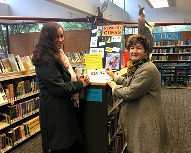 Youth Services Librarian Sara Butts (left) and Branch Manager Julie Magnus smile at the Corte Madera Library.