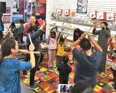 Several kids have fun during an activity inside the Northgate pop-up library branch.