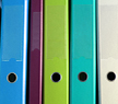 A row of binders representing a collection of policies.