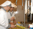 Two chefs preparing food