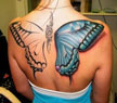 A lady with a butterfly tatoo on her back
