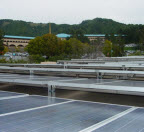 Solar Panels on a roof with the Civic Center in the background