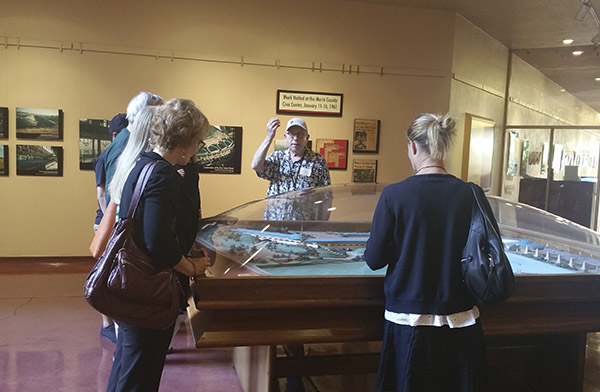 People looking at a model of the proposed Marin County Civic Center