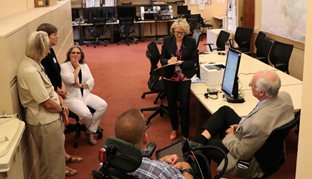 Lynda Roberts taking notes from the Election Advisory Committee, about Marin County's new accessible ballot marking device