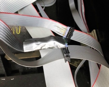 A close-up view of an illegal credit card skimming device installed inside a gas pump.