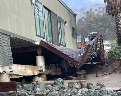 The deck of a home in Stinson Beach is shown collapsed because of storm damage.