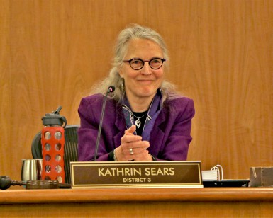 Supervisor Kate Sears sits behind her nameplate in her Board of Supervisors seat.