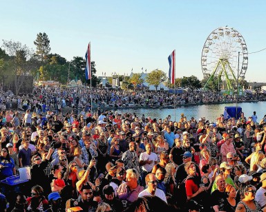 A crowd of at least 1,000 people listens to a band at the Marin County Fair.