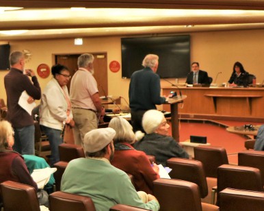 Residents line up at the microphone to speak before the Board of Supervisors about the San Geronimo Golf Course property on January 29.