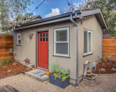 An exterior view of an accessory dwelling unit, which looks like a very small house.
