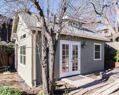 An exterior view of an accessory dwelling unit (ADU) in somebody's backyard.