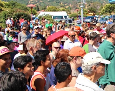 A crowd of people waits to buy tickets to the Marin County Fair.