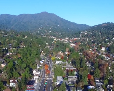 An aerial view of downtown Mill Valley with Mt. Tamalpais in the background.