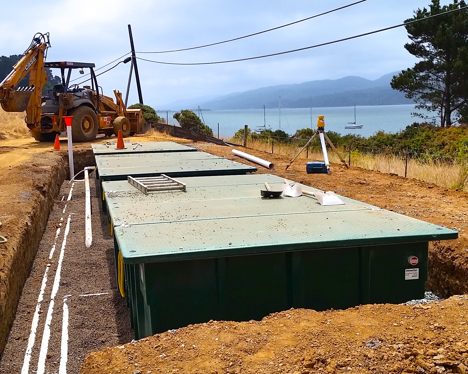 A new septic tank is installed near the shore of Tomales Bay.