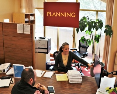 Senior Planner Inge Lundegaard assists a resident at the Community Development Agency's service desk.