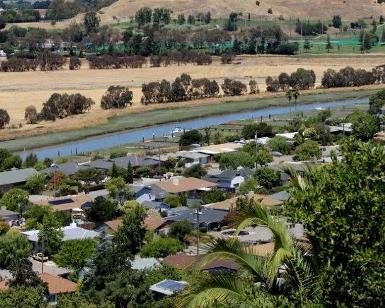 A hilltop view of Santa Venetia, looking down on homes and Las Gallinas Creek