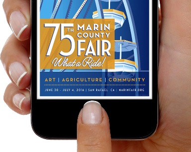 A hand holds a smartphone featuring the Marin County Fair app