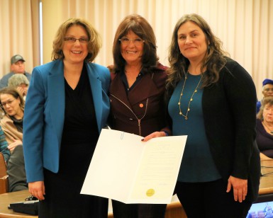 From left to right, Rosemary Slote of the DA's Office, Supervisor Judy Arnold and Gina Vucci of the Marin Coalition to End Human Trafficking pose with the printed Board of Supervisors resolution.