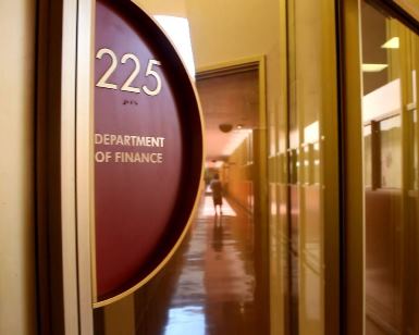 A close-up view of the sign saying "Department of Finance" at the Civic Center