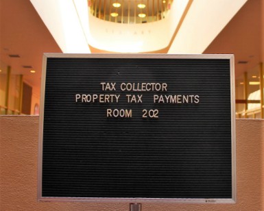 Posted sign at the Marin County Civic Center saying that tax payments may be made in Room 202.