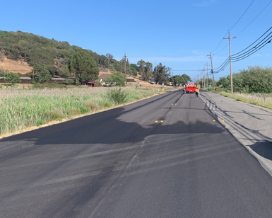 A closeup view of a segment of repaved road in unincorporated Novato.
