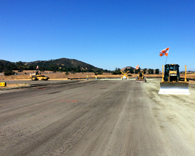 Heavy equipment is shown smoothing out the Gnoss Field runway at the start of the renovation project in September.