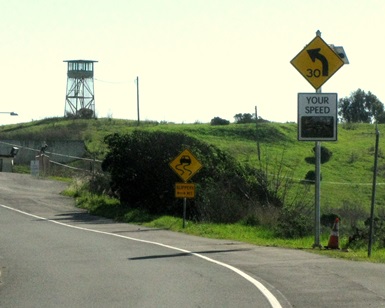 An electronic road sign displays a moving vehicle's speed limit on Sir Francis Drake Boulevard near San Quentin State Prison. The signage was part of a recent HSIP grant.