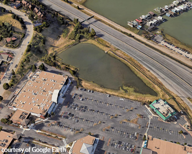 An aerial view from Google Earth of the small pond in Marin City adjacent to the Gateway shopping center and Highway 101.