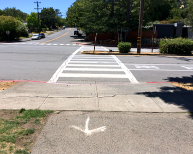 A closeup view of a crosswalk on Miller Creek Road in Marinwood that is targeted for renovation.