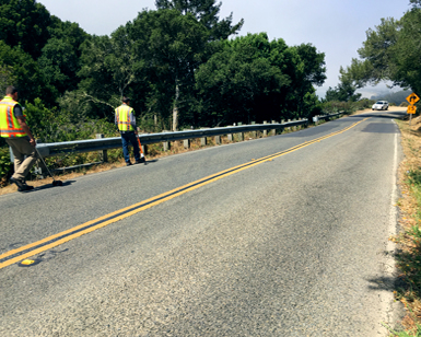 County engineers inspecting the guardrails along panoramic highway overlooking stinson beach