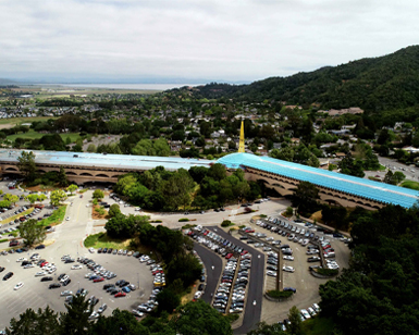 Birds eye view of the Marin County Civic Center, depicting roof replacement work in progress on the Hall of Justice wing of the building. 