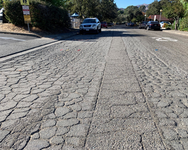 A closeup view of deteriorated pavement that will be resurfaced.