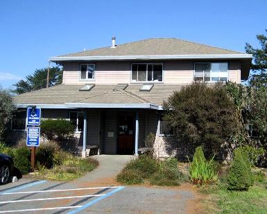 A parking lot view of the West Marin Service Center
