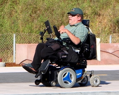 Peter Mendoza of the Marin Center for Independent Living is shown riding in his wheelchair.