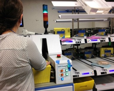 An Elections Department employee operates a new ballot sorter machine at the Civic Center after the November 5, 2019, election.