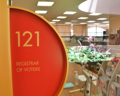 A closeup view of the sign that says Registrar of Voters outside the elections office.
